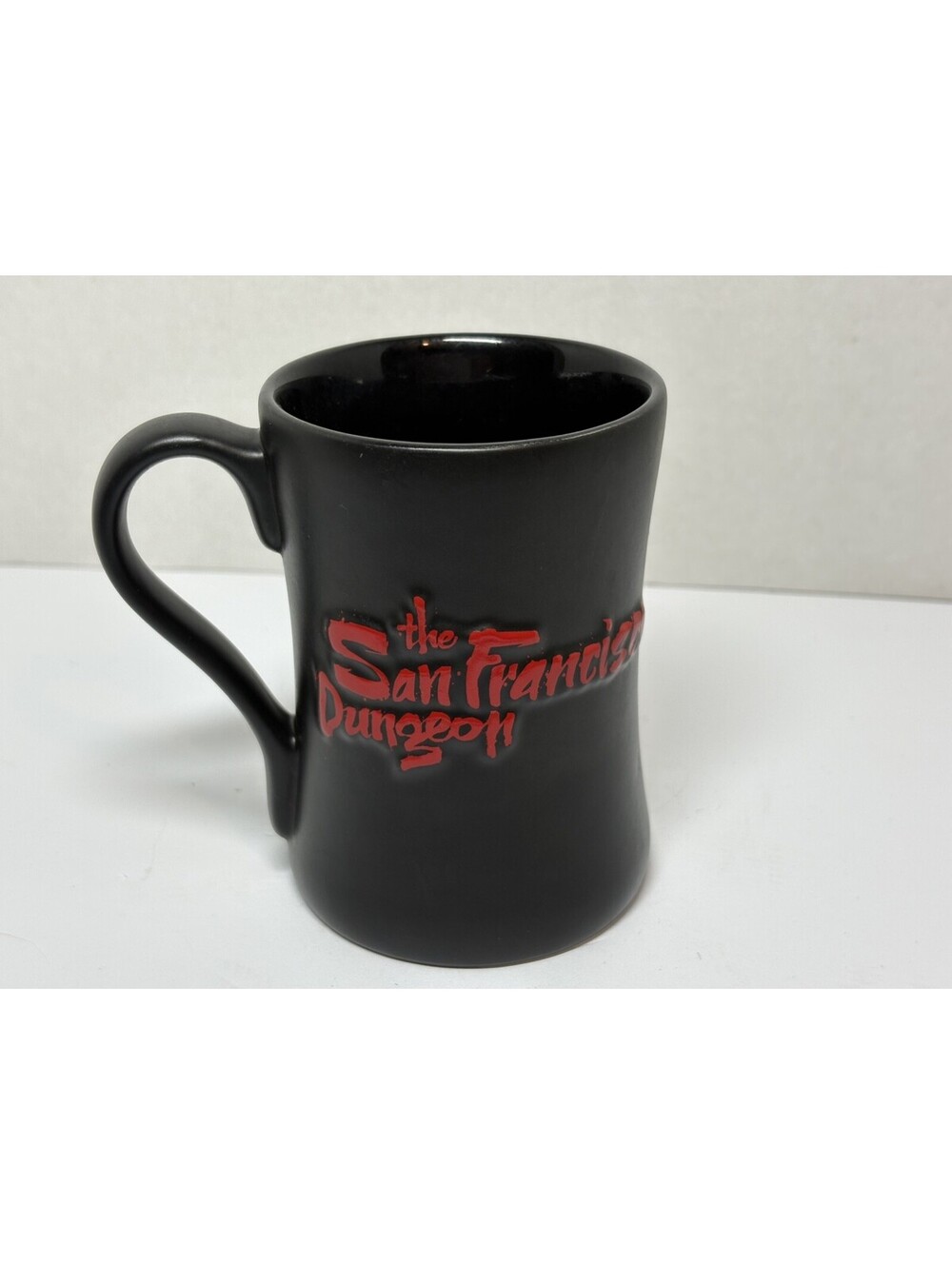 San Francisco Dungeon Souvenir Coffee Mug Black Red Raised Lettering 2014